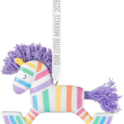 Our Little Miracle 2026, porcelain and fabric ornament with pastel stripes and lavender mane, detailed close-up view.