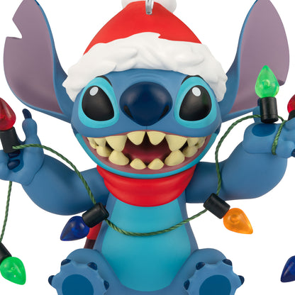 Disney Lilo & Stitch Shines Bright — 2026 Hallmark Keepsake Christmas Ornament featuring Stitch in a Santa hat holding Christmas lights.