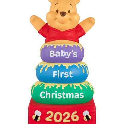 Disney Winnie the Pooh Baby's First Christmas 2026 — 2026 Hallmark Keepsake Christmas Ornament featuring Pooh and colourful stacking rings with honey details.