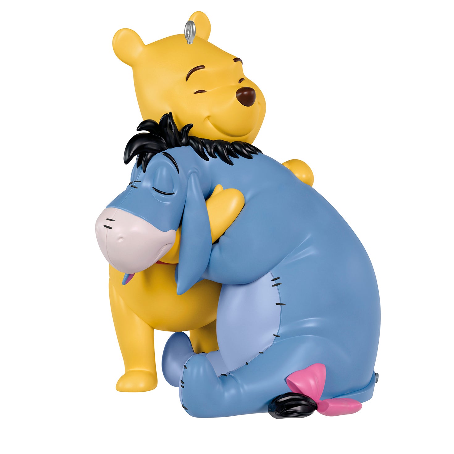 Disney Winnie the Pooh Holiday Hugs — 2026 Hallmark Keepsake Christmas Ornament featuring Pooh Bear and Eeyore embracing in vibrant colours.