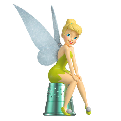 Disney Peter Pan Precocious Pixie — 2026 Hallmark Keepsake Christmas Ornament featuring Tinker Bell in a green dress with pixie wings, sitting on a thimble.