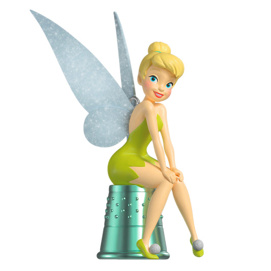 Disney Peter Pan Precocious Pixie — 2026 Hallmark Keepsake Christmas Ornament featuring Tinker Bell in a green dress with pixie wings, sitting on a thimble.