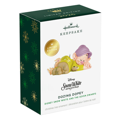 Disney Snow White and the Seven Dwarfs Dozing Dopey — 2026 Hallmark Keepsake Christmas Ornament in limited edition packaging, angled view.