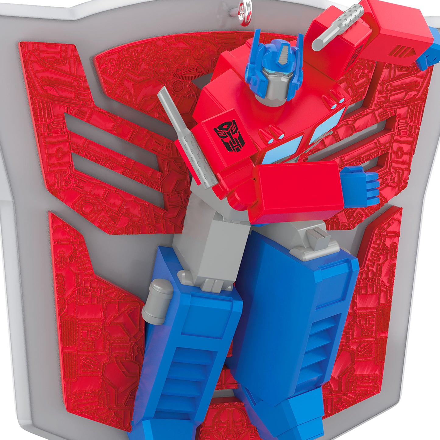 Hasbro Transformers Optimus Prime's Power — 2026 Hallmark Keepsake Christmas Ornament in action pose before red and grey shield.