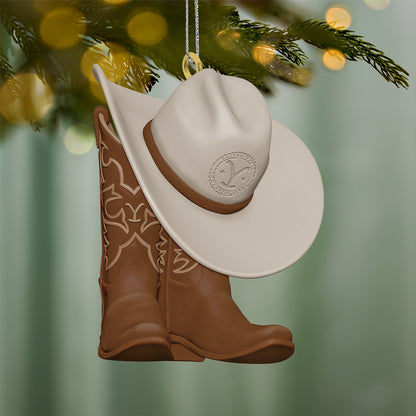 Yellowstone Wear the Brand — 2026 Hallmark Keepsake Christmas Ornament featuring brown cowboy boots and a cream cowboy hat hanging on a tree.