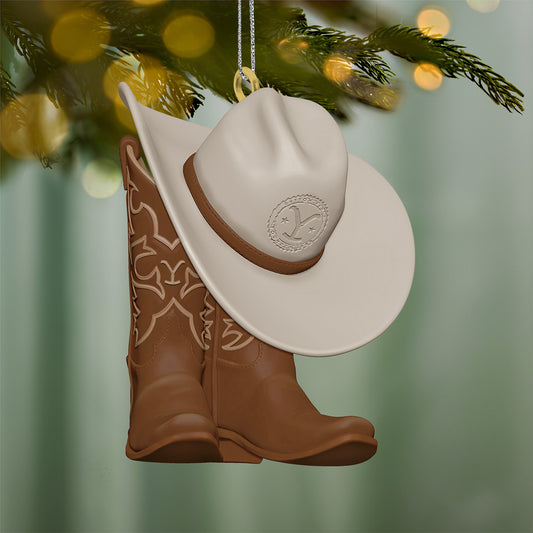 Yellowstone Wear the Brand — 2026 Hallmark Keepsake Christmas Ornament featuring brown cowboy boots and a cream cowboy hat hanging on a tree.