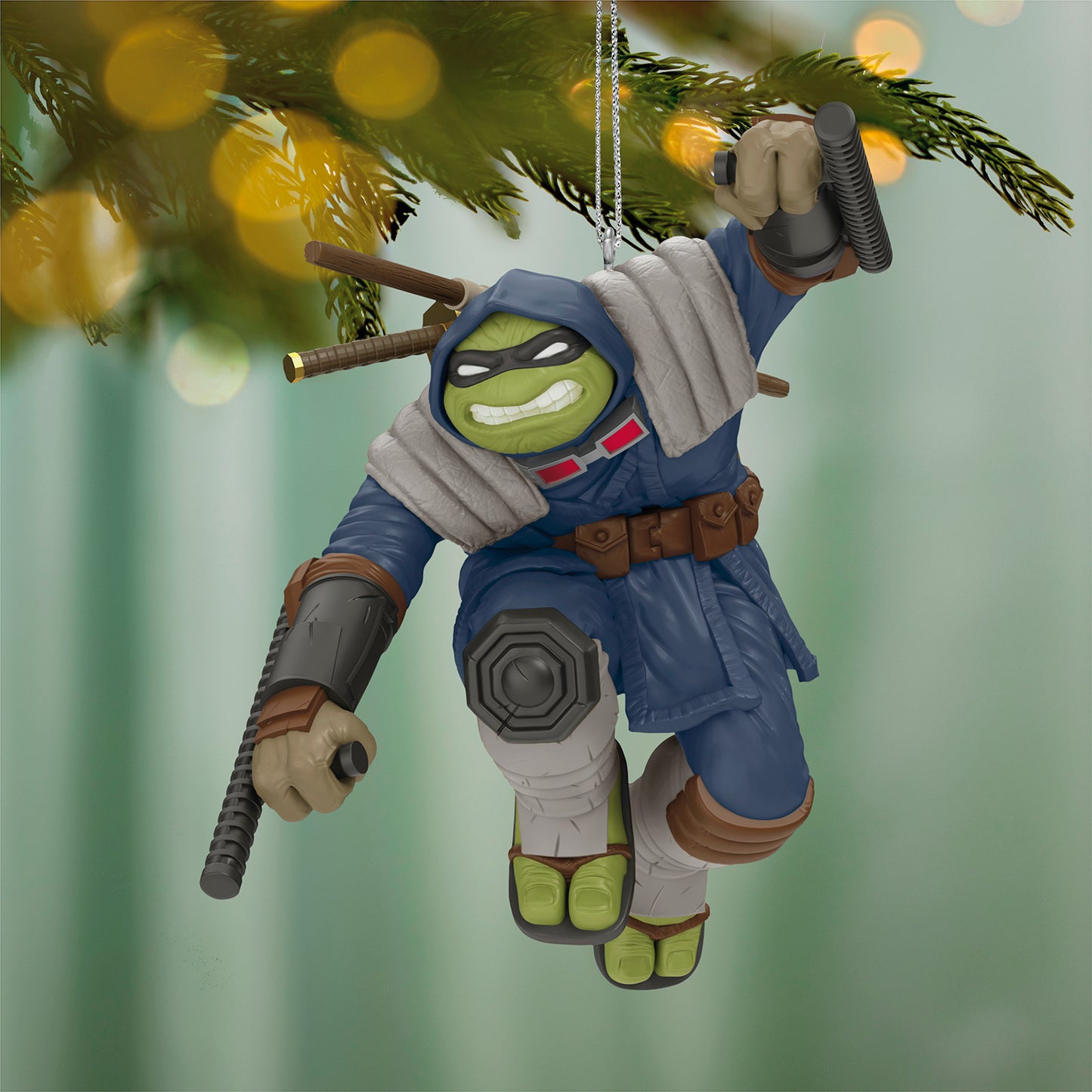 Teenage Mutant Ninja Turtles The Last Ronin — 2026 Hallmark Keepsake Christmas Ornament featuring the mutant turtle in a blue coat, hanging from a tree.