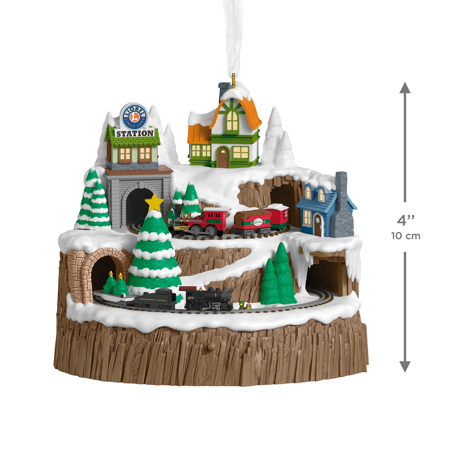 Lionel Christmas Mountain Musical With Light and Motion — 2026 Hallmark Keepsake Christmas Ornament featuring a snowy landscape with a train station, trees, and tunnels, flat lay view.
