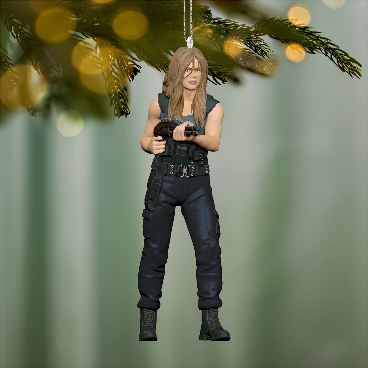 Terminator 2: Judgment Day™ Sarah Connor — 2026 Hallmark Keepsake Christmas Ornament in a detailed design, hanging from a tree branch with bokeh lights.