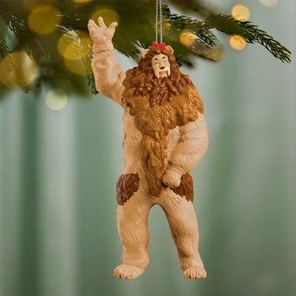 The Wizard of Oz™ Cowardly Lion — 2026 Hallmark Keepsake Christmas Ornament, detailed figure with bushy mane, hanging from a tree branch.
