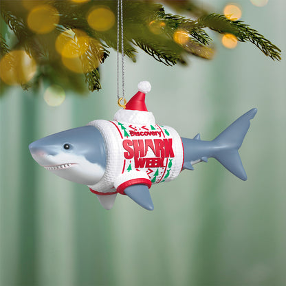 Discovery™ Shark Week — 2026 Hallmark Keepsake Christmas Ornament featuring a great white shark in an ugly Christmas sweater and Santa hat, hanging from a tree.