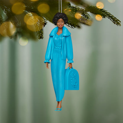 Barbie™ Beauty Secrets Christie — 2026 Hallmark Keepsake Christmas Ornament in vibrant turquoise dress holding a beauty case, hanging from a Christmas tree.