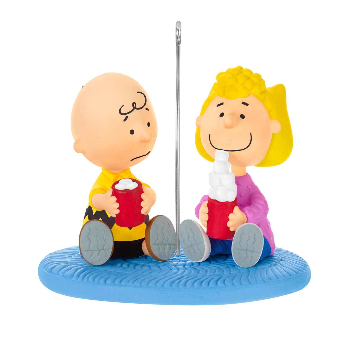 The Peanuts Gang More Marshmallows, Please! — 2026 Hallmark Keepsake Christmas Ornament depicting Charlie Brown and Sally with hot chocolate mugs on blue rug.