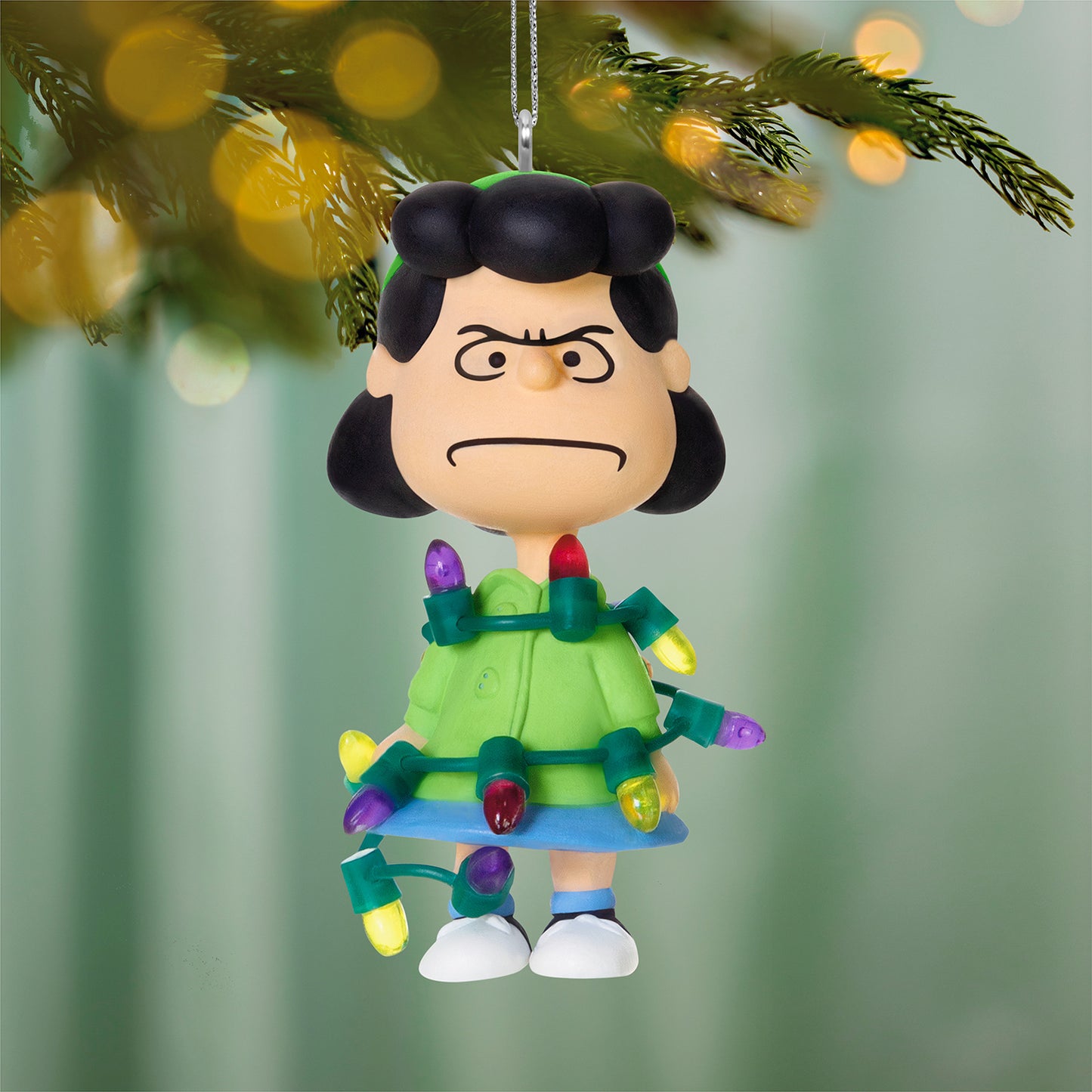 The Peanuts® Gang Lucy's All Tangled Up! — 2026 Hallmark Keepsake Christmas Ornament, featuring Lucy with Christmas lights, close-up view.