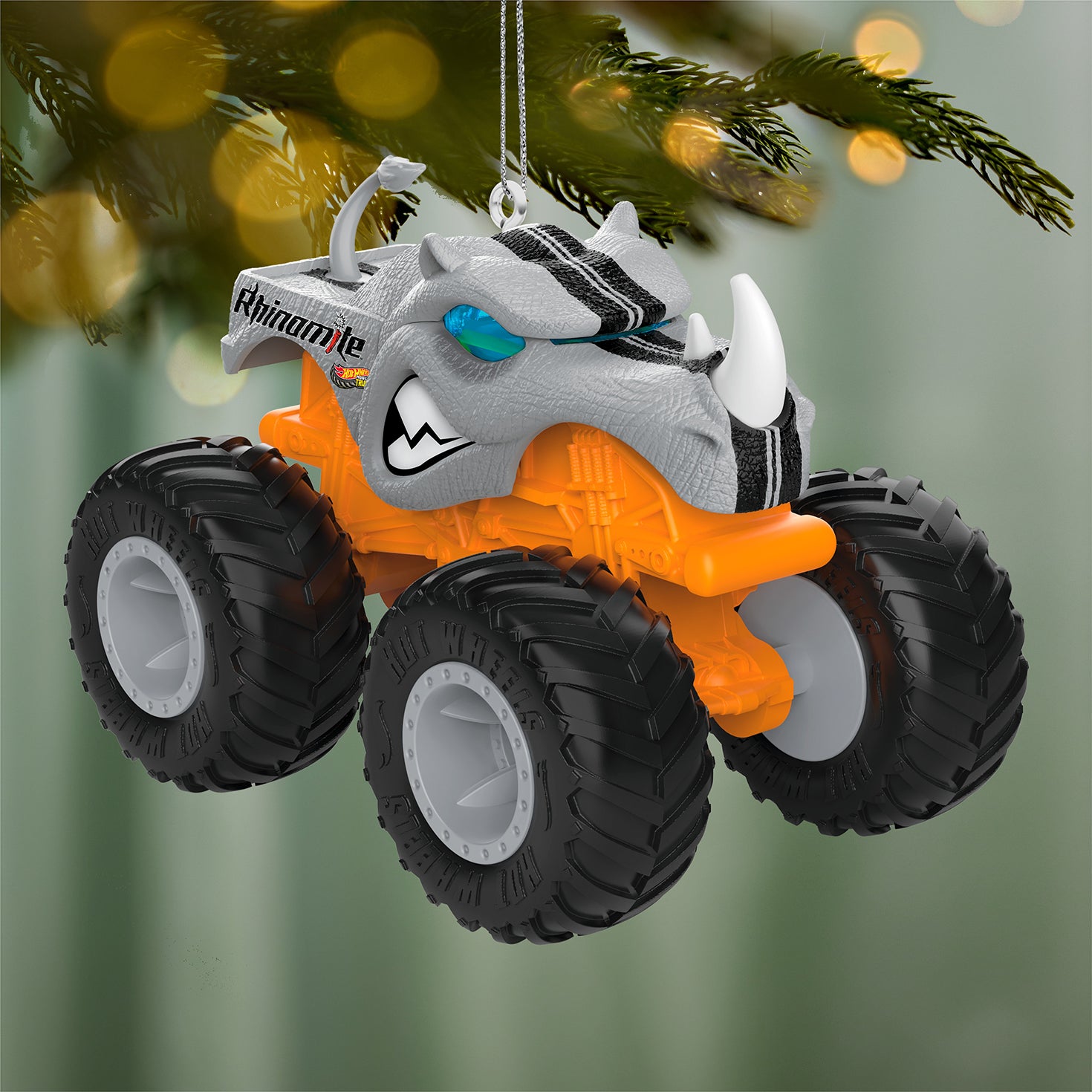 Hot Wheels Monster Trucks™ Rhinomite™ — 2026 Hallmark Keepsake Christmas Ornament, vibrant orange with gray rhinoceros head, hanging on tree.
