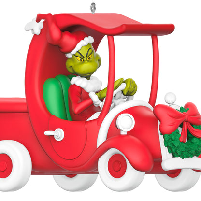 Dr. Seuss's How the Grinch Stole Christmas! A Grinchy Sleigh On the Way — 2026 Hallmark Keepsake Christmas Ornament featuring Grinch in Santa suit driving a red truck decorated with a wreath.