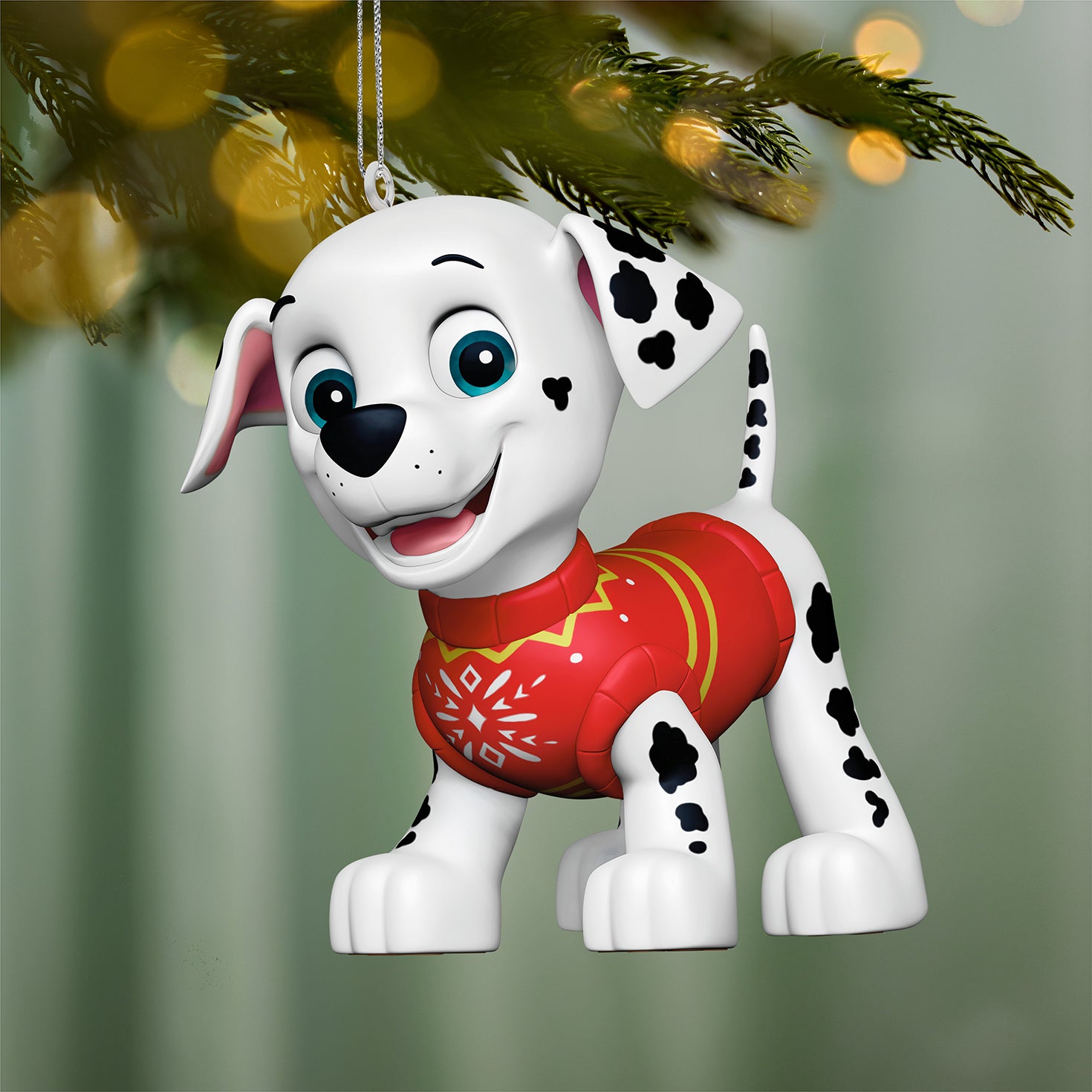 Paw Patrol™ Merry Marshall — 2026 Hallmark Keepsake Christmas Ornament featuring a cheerful Dalmatian pup in a red festive sweater, hanging from a Christmas tree.