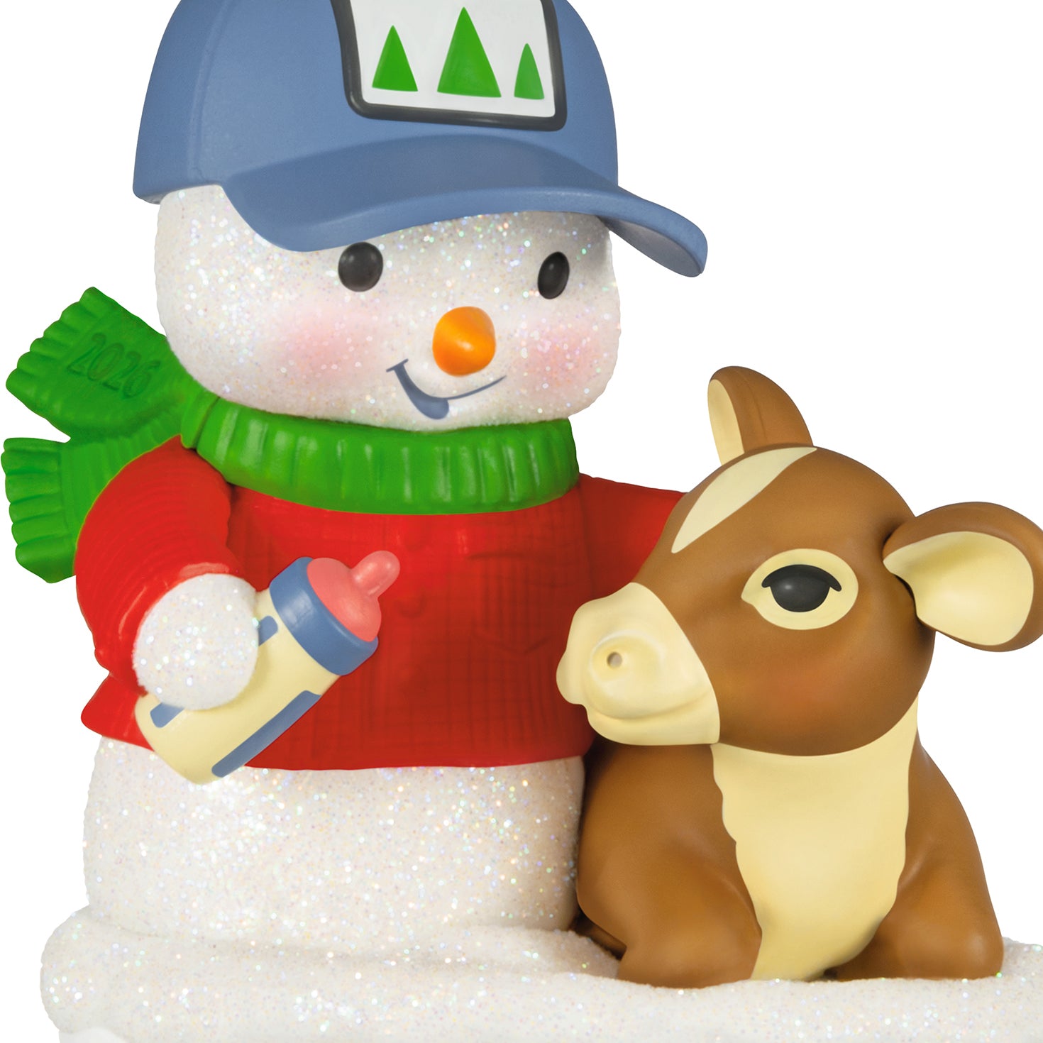 Snow Buddies, 29th in the Series — 2026 Hallmark Keepsake Christmas Ornament, featuring a glittery snowman in a red sweater and cap, feeding a calf.