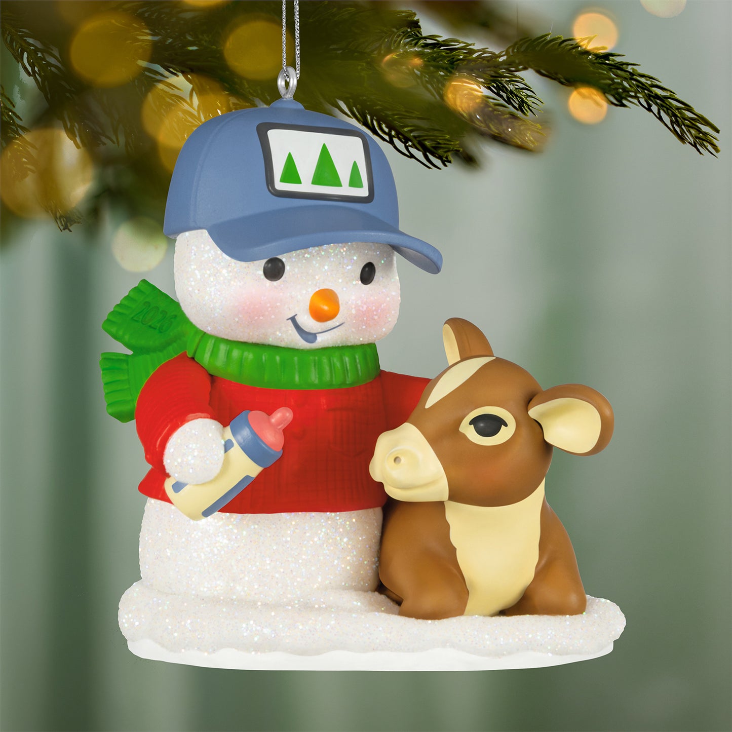 Snow Buddies, 29th in the Series — 2026 Hallmark Keepsake Christmas Ornament featuring a snowman in a red sweater with a calf.
