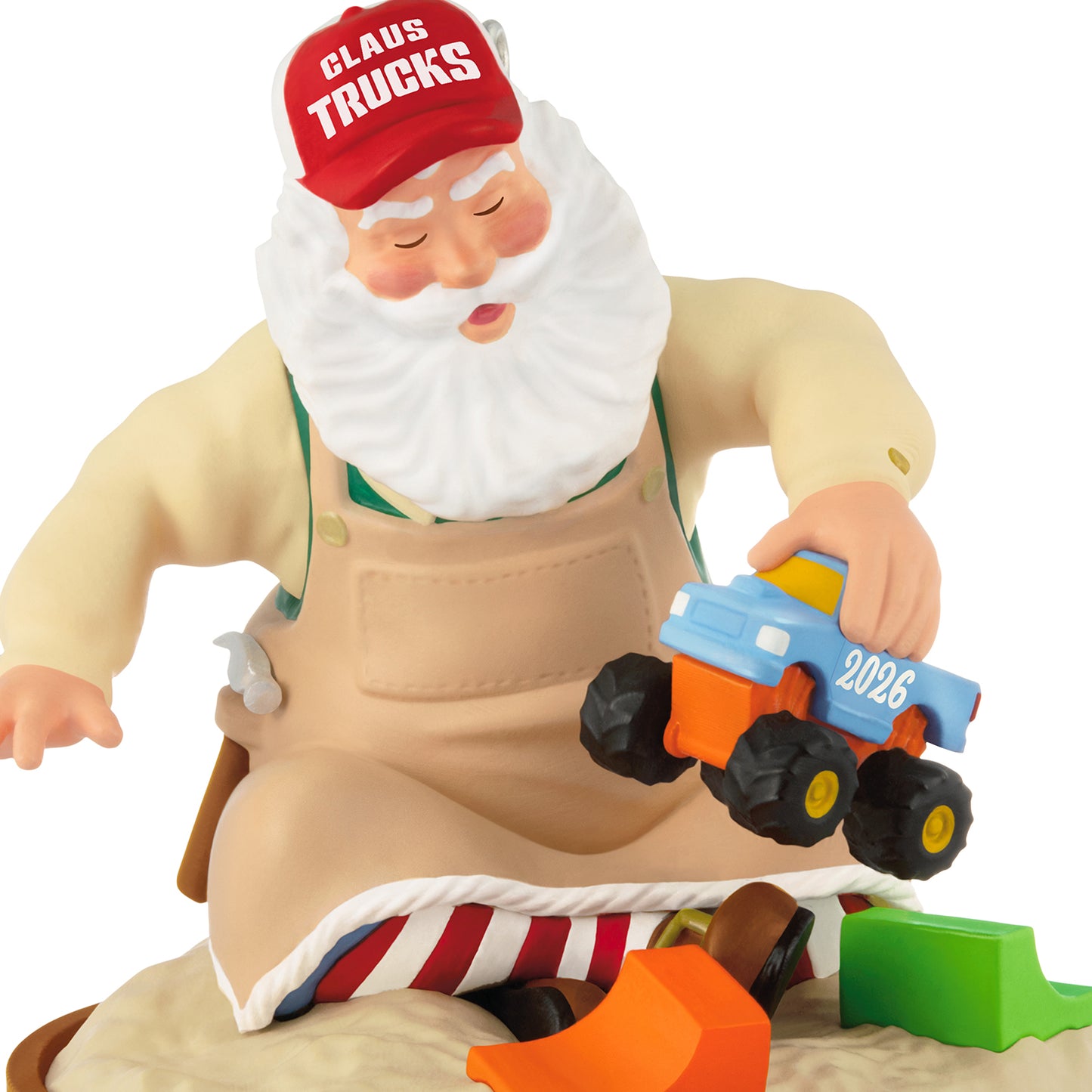 Toymaker Santa, 27th in the Series — 2026 Hallmark Keepsake Christmas Ornament, detailed view of Santa testing a monster truck in the sandbox.