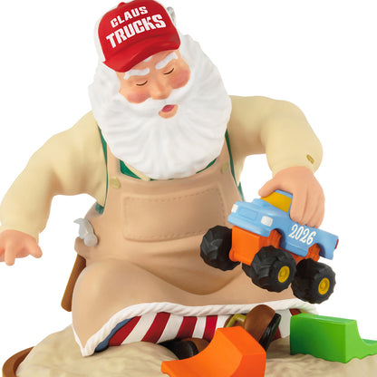 Toymaker Santa, 27th in the Series — 2026 Hallmark Keepsake Christmas Ornament, detailed view of Santa testing a monster truck in the sandbox.
