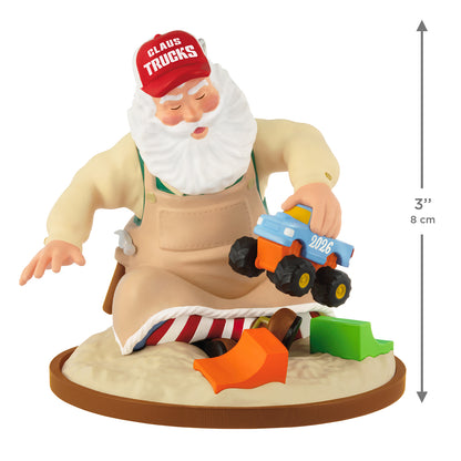 Toymaker Santa, 27th in the Series — 2026 Hallmark Keepsake Christmas Ornament, detailed figure in apron testing a toy truck in sand.