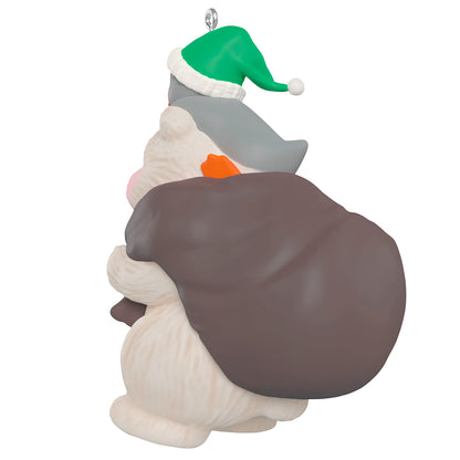 Snowball and Tuxedo Gift Givers, 26th in the series — 2026 Hallmark Keepsake Christmas Ornament, back view of Snowball with green hat and gift bag.