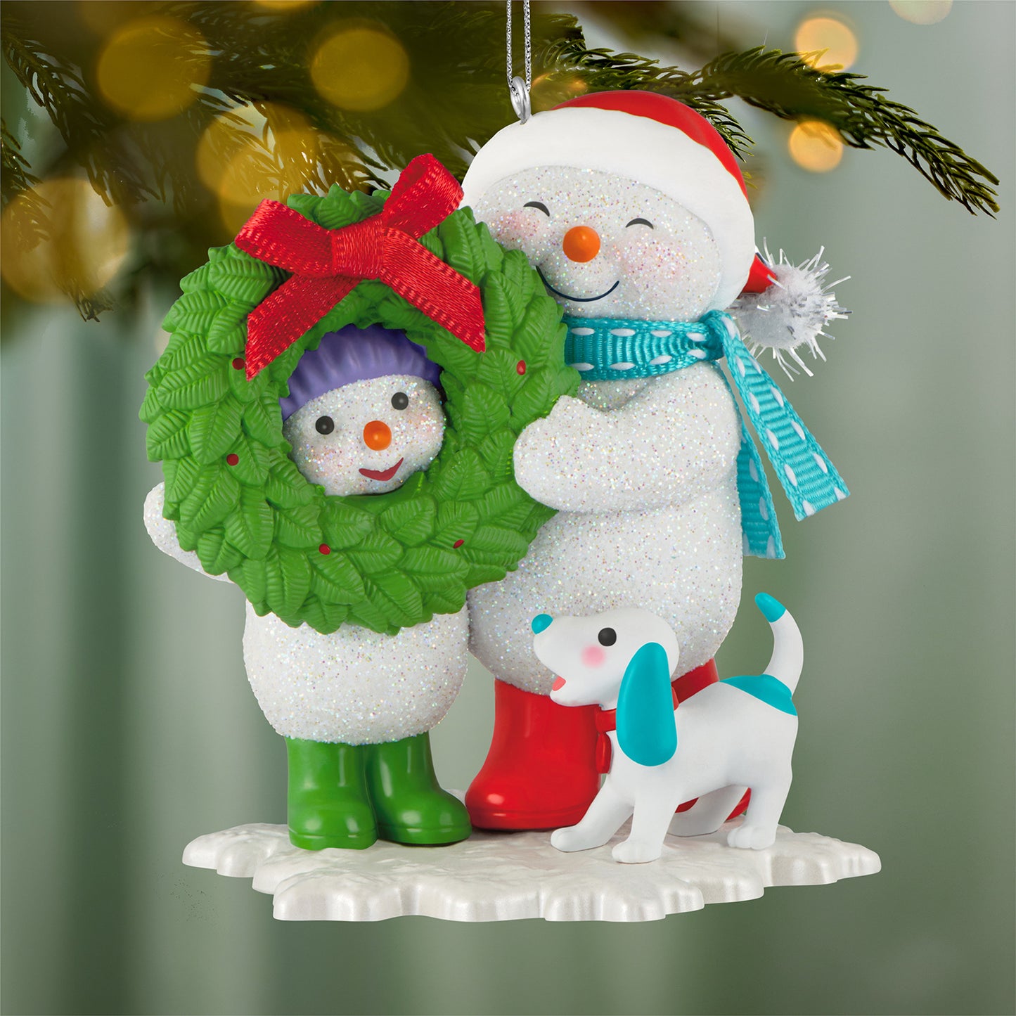 Making Memories Welcoming Wreath, 19th in the Series — 2026 Hallmark Keepsake Christmas Ornament featuring a joyful snowman and child holding a wreath, with a small dog.