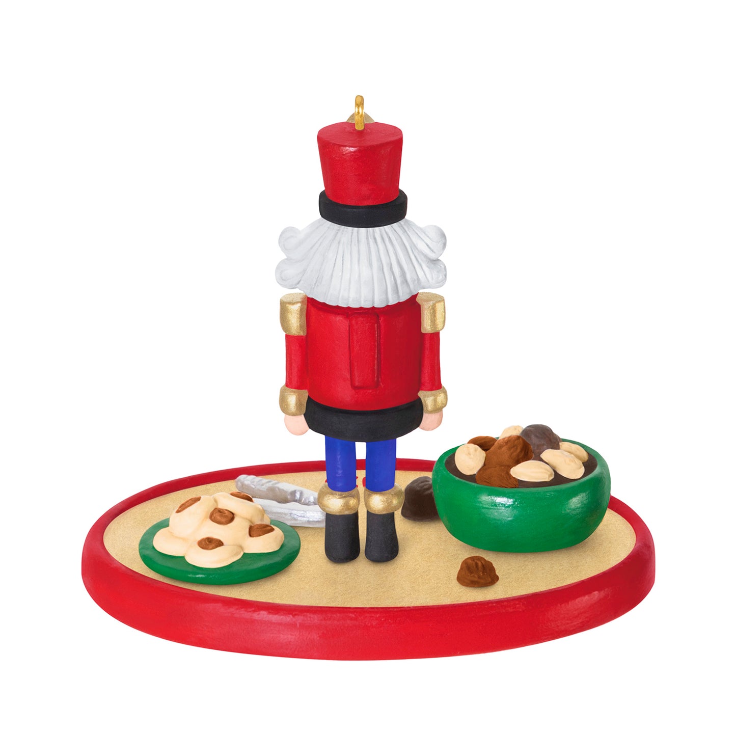 Season's Treatings 2026, 18th in the Series — 2026 Hallmark Keepsake Christmas Ornament featuring a nutcracker soldier with cookies and nuts on a platter, back view.