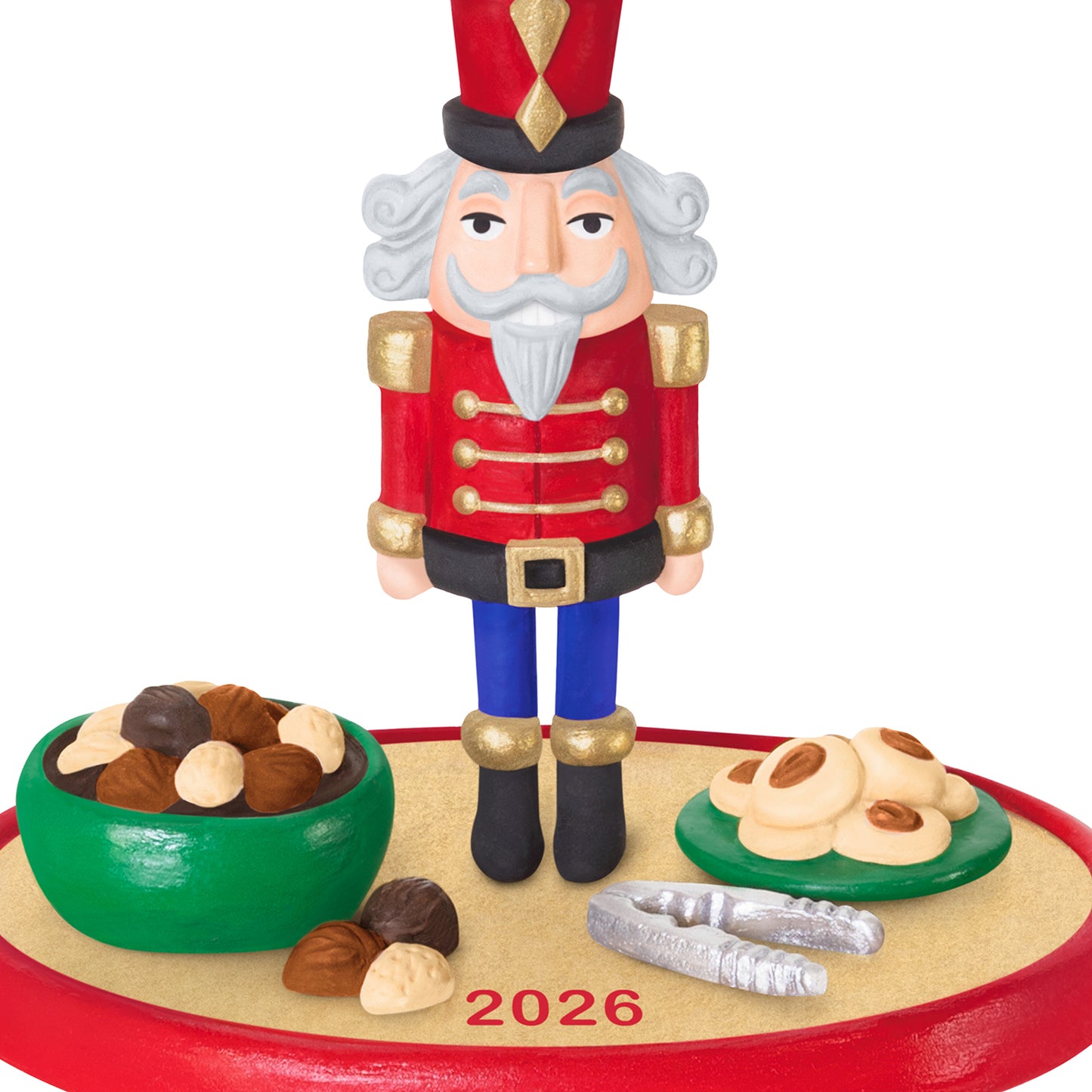 Season's Treatings 2026, 18th in the Series — 2026 Hallmark Keepsake Christmas Ornament featuring a nutcracker soldier, colourful bowls of nuts and cookies, close-up view.