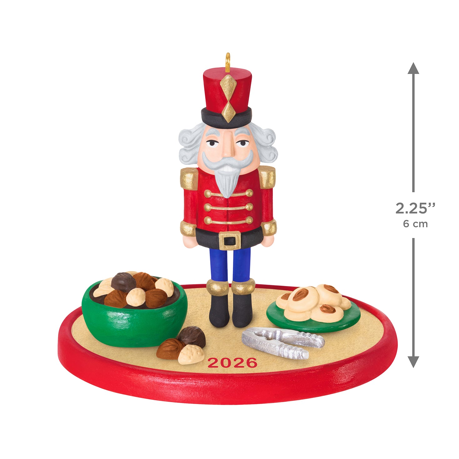 Season's Treatings 2026, 18th in the Series — 2026 Hallmark Keepsake Christmas Ornament featuring a nutcracker soldier with bowls of nuts and cookies in a flat lay view.