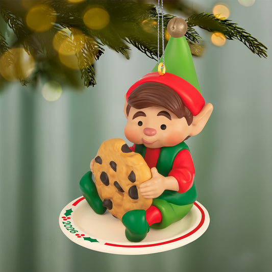 North Pole Tree Trimmers, 14th in the Series — 2026 Hallmark Keepsake Christmas Ornament featuring a cheerful elf enjoying a cookie on a decorative plate.