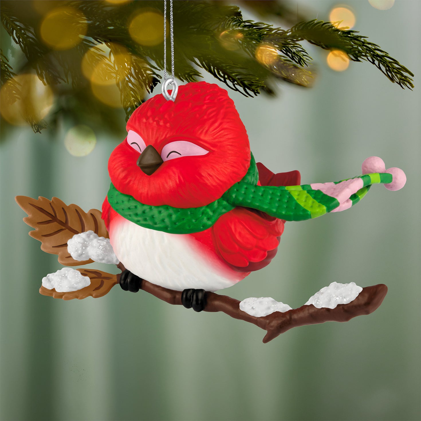 Cozy Critters, 10th in the Series — 2026 Hallmark Keepsake Christmas Ornament featuring a bright red bird wearing a green scarf on a branch.