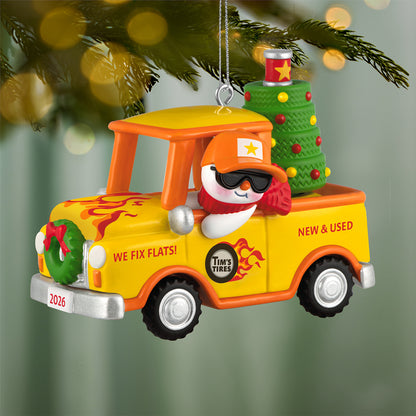 Holiday Parade 2026, 8th in the Series — 2026 Hallmark Keepsake Christmas Ornament featuring a snowman in a vibrant yellow pickup truck with a Christmas tree.