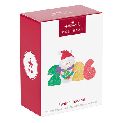 Sweet Decade 2026, 7th in the Series — 2026 Hallmark Keepsake Christmas Ornament packaging featuring a snowman and vibrant gumdrop numbers.