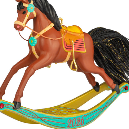 Rocking Horse Memories 2026, 7th in the Series — 2026 Hallmark Keepsake Christmas Ornament, detailed view of golden brown horse with vibrant saddle.