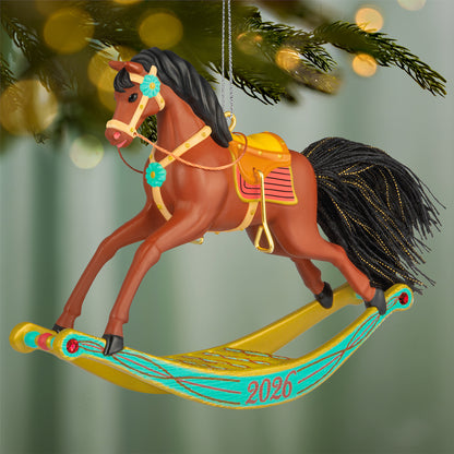 Rocking Horse Memories 2026, 7th in the Series — 2026 Hallmark Keepsake Christmas Ornament, detailed rocking horse with golden brown colour and colourful accents, hanging on tree.