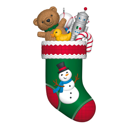Stocking Stuffers, 6th in the Series — 2026 Hallmark Keepsake Christmas Ornament featuring a green stocking with festive toys, including a teddy bear and snowman.