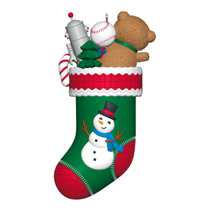 Stocking Stuffers, 6th in the Series — 2026 Hallmark Keepsake Christmas Ornament featuring a green stocking filled with toys, snowman detail.
