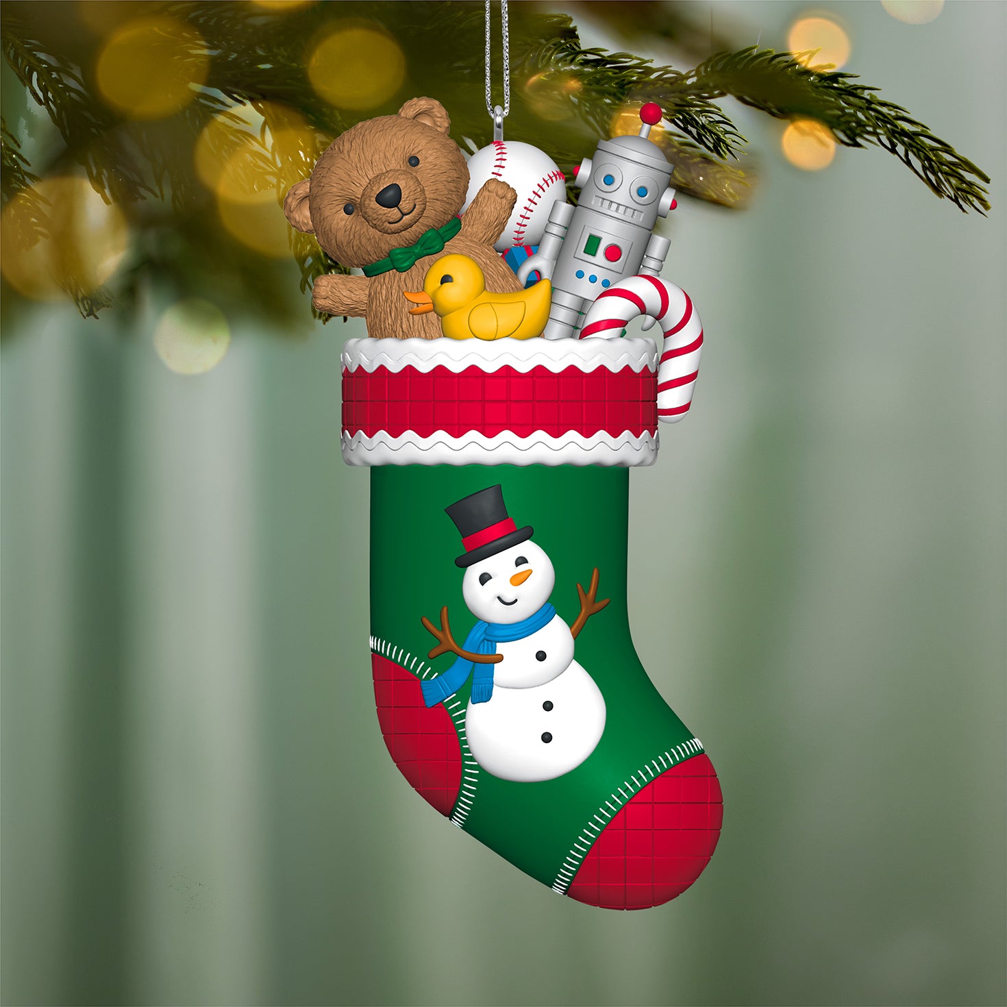 Stocking Stuffers, 6th in the Series — 2026 Hallmark Keepsake Christmas Ornament featuring a green stocking filled with toys, angled view, festive decoration