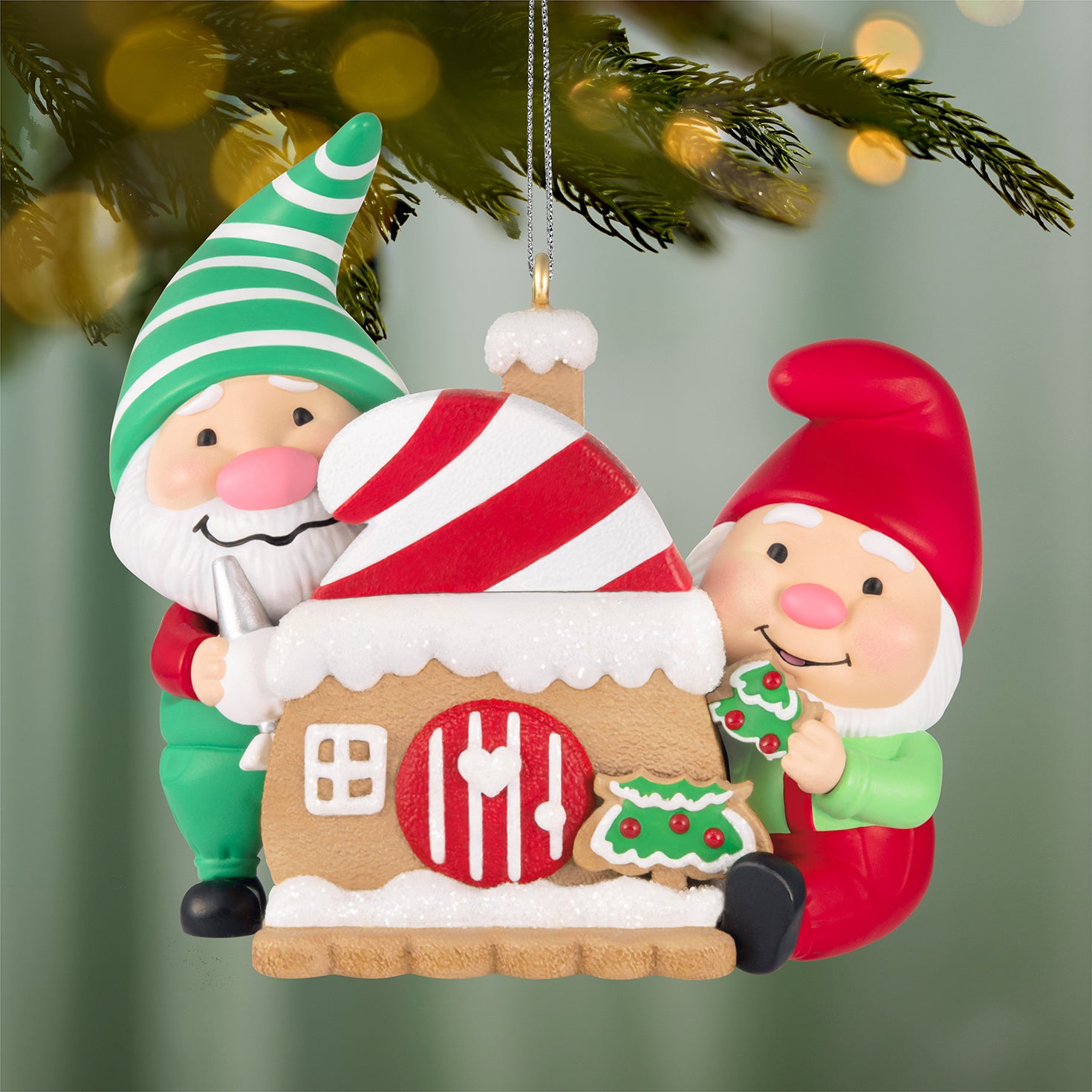 Gnome for Christmas, 6th in the Series — 2026 Hallmark Keepsake Christmas Ornament featuring two gnomes by a gingerbread house, close up view.