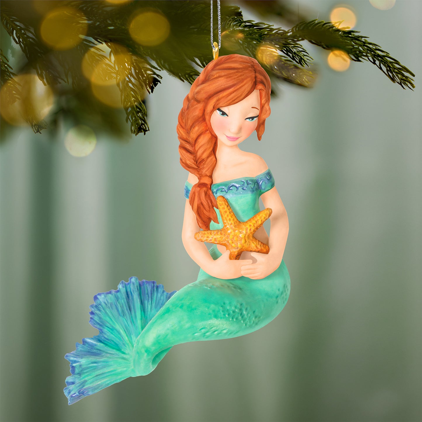 Mythical Mermaids, 4th in the Series — 2026 Hallmark Keepsake Christmas Ornament, detailed mermaid with auburn braid, holding a starfish, displayed on tree.