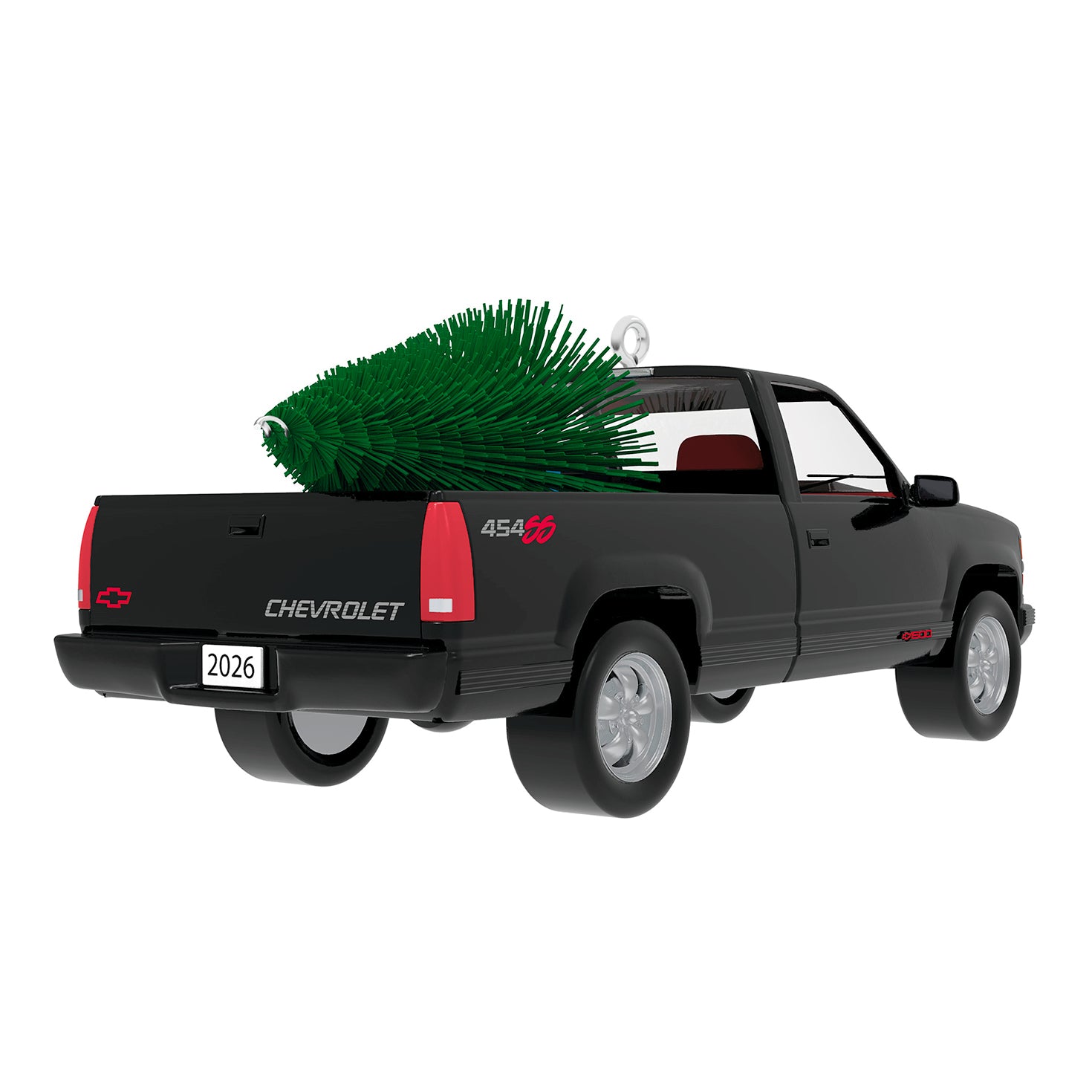 All-American Trucks 1993 Chevrolet® 454 SS 2026 metal ornament, black truck design with red interior and festive tree in back.