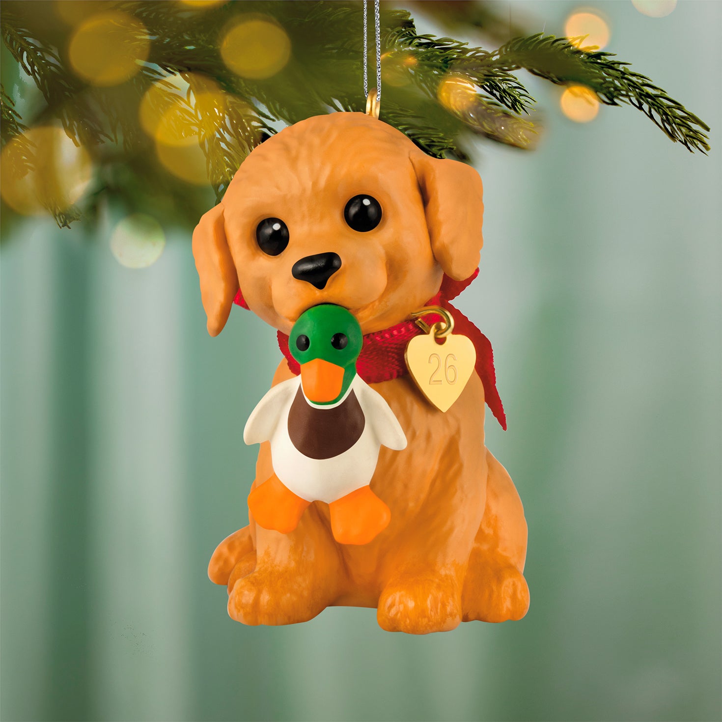 Puppy Love Golden Retriever 2026, 36th in the Series — 2026 Hallmark Keepsake Christmas Ornament with a golden retriever holding a duck.