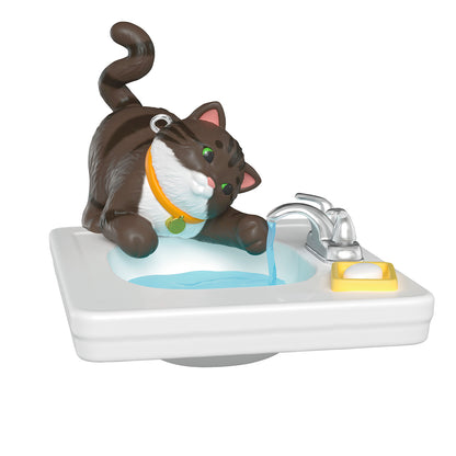 Mischievous Kittens, 28th in the Series — 2026 Hallmark Keepsake Christmas Ornament of a playful brown and black kitten at a sink.