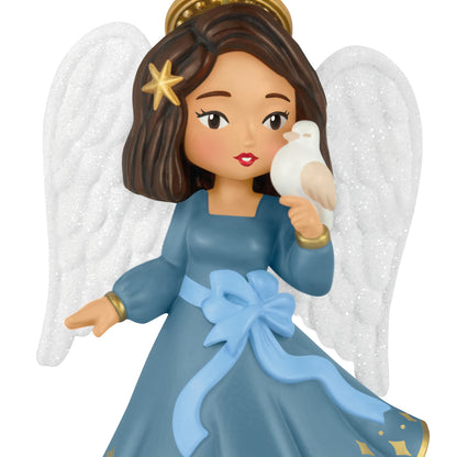 Heirloom Angels, 11th in the Series — 2026 Hallmark Keepsake Christmas Ornament featuring a brunette angel in a blue dress with glittery wings holding a dove.
