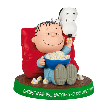 The Peanuts® Gang Christmas Is...Watching Holiday Movies Together, 3rd in the Series — 2026 Hallmark Keepsake Christmas Ornament featuring Linus and Snoopy sharing popcorn.
