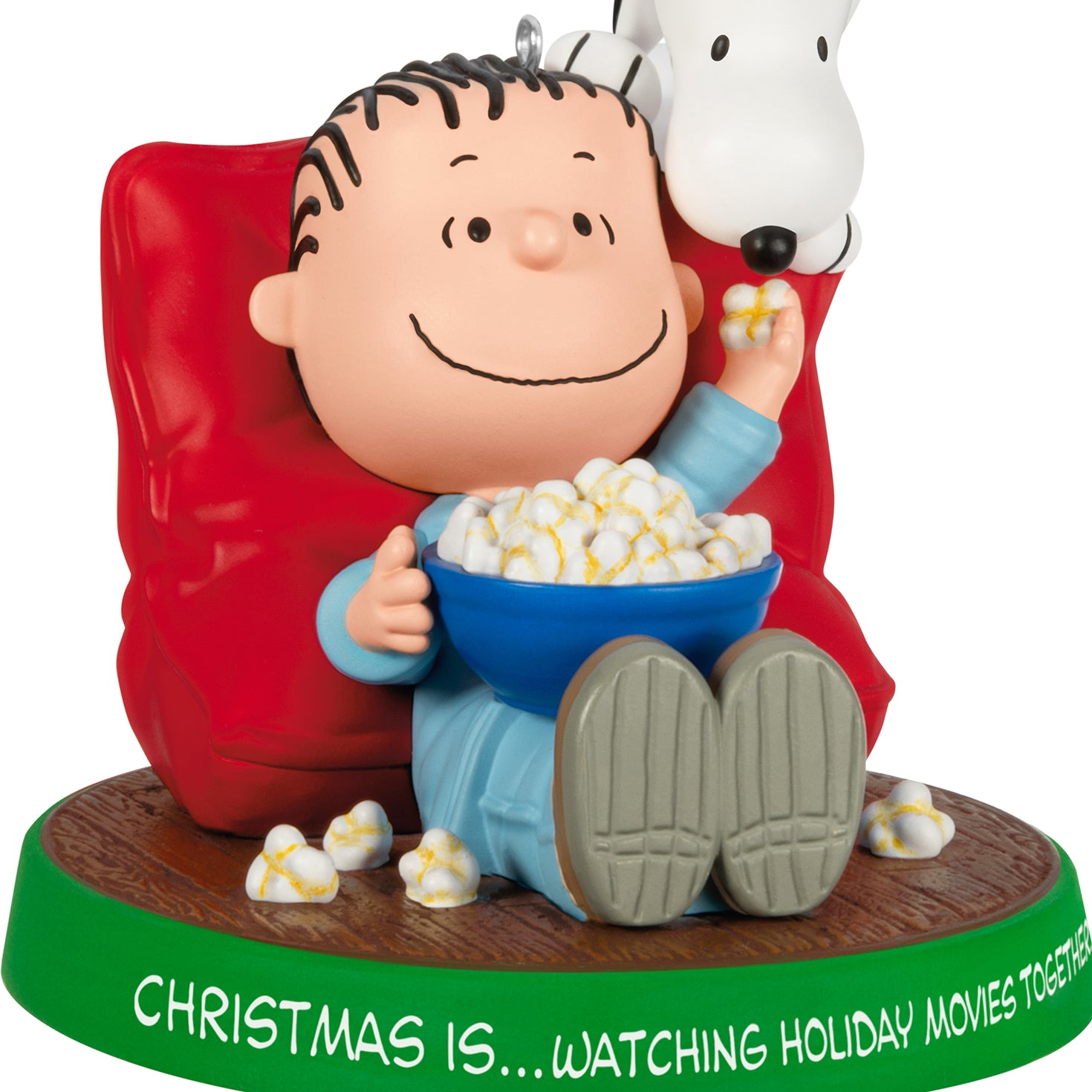 The Peanuts® Gang Christmas Is...Watching Holiday Movies Together, 3rd in the Series — 2026 Hallmark Keepsake Christmas Ornament, featuring Linus and Snoopy sharing popcorn in a red chair.