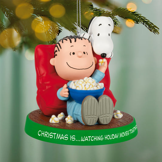 The Peanuts® Gang Christmas Is...Watching Holiday Movies Together, 3rd in the Series — 2026 Hallmark Keepsake Christmas Ornament featuring Linus and Snoopy enjoying popcorn.