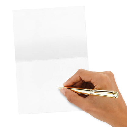 Hallmark Thank You Cards Assortment, Bold Type featuring a hand writing on a blank card with a gold pen against a white background.